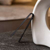 Carbon Grip tongs beside a white ceramic mabkhar