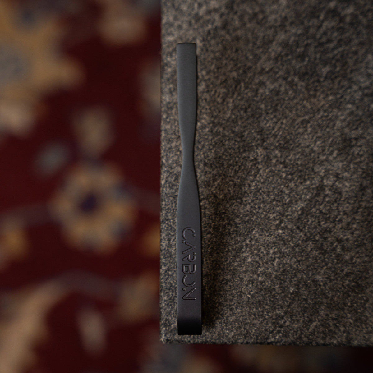Carbon Grip matte black tongs, close-up