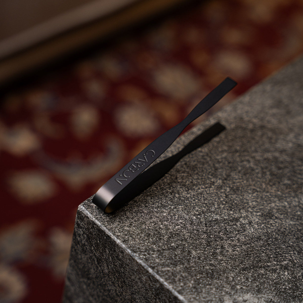 Carbon Grip tongs resting on a stone edge
