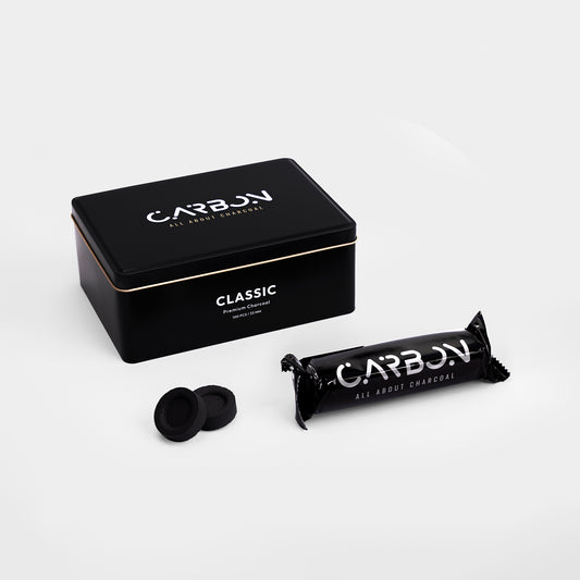 Carbon Classic 33mm charcoal tin with a roll and two pieces